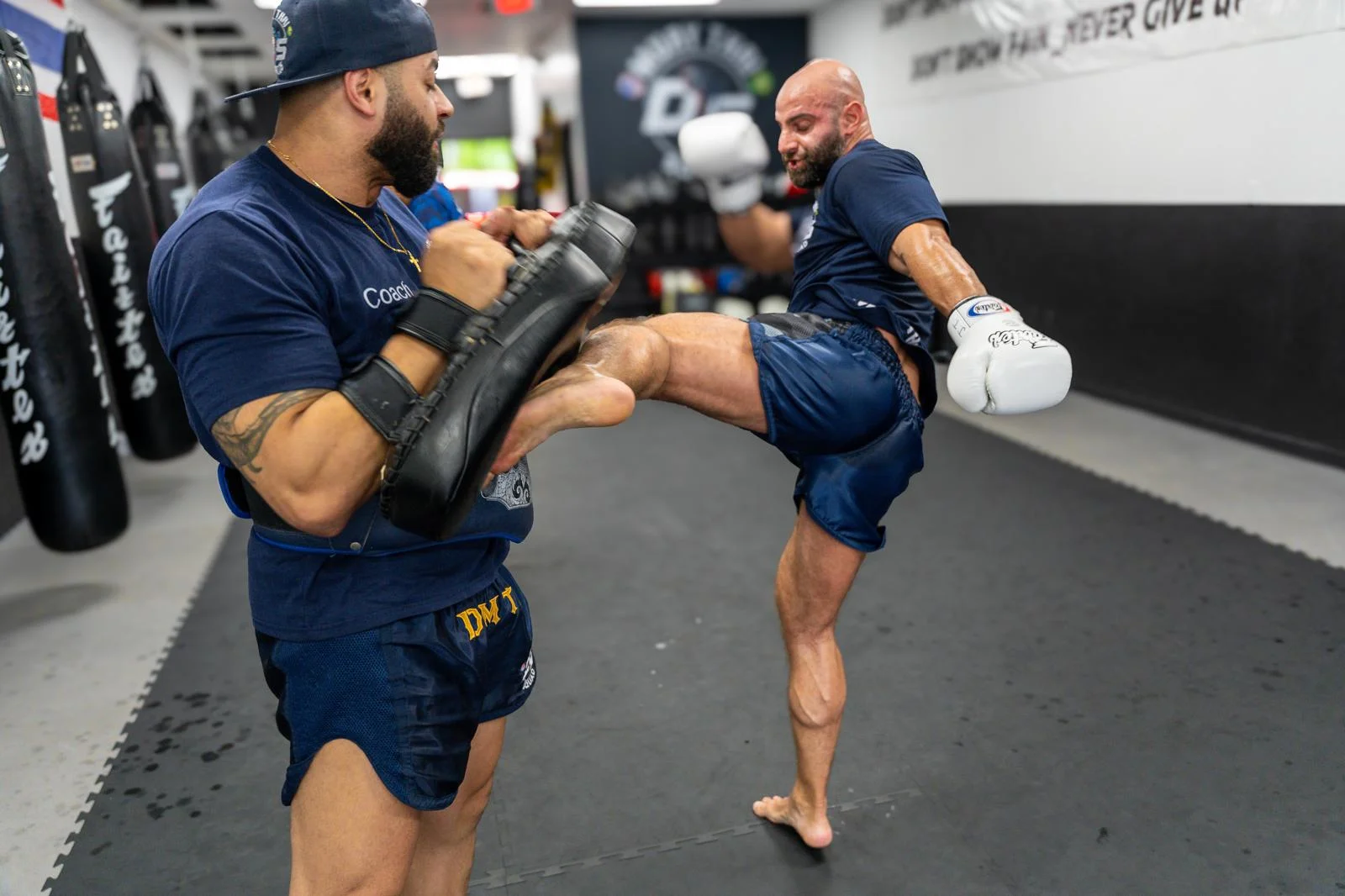 Adult kicking the pads