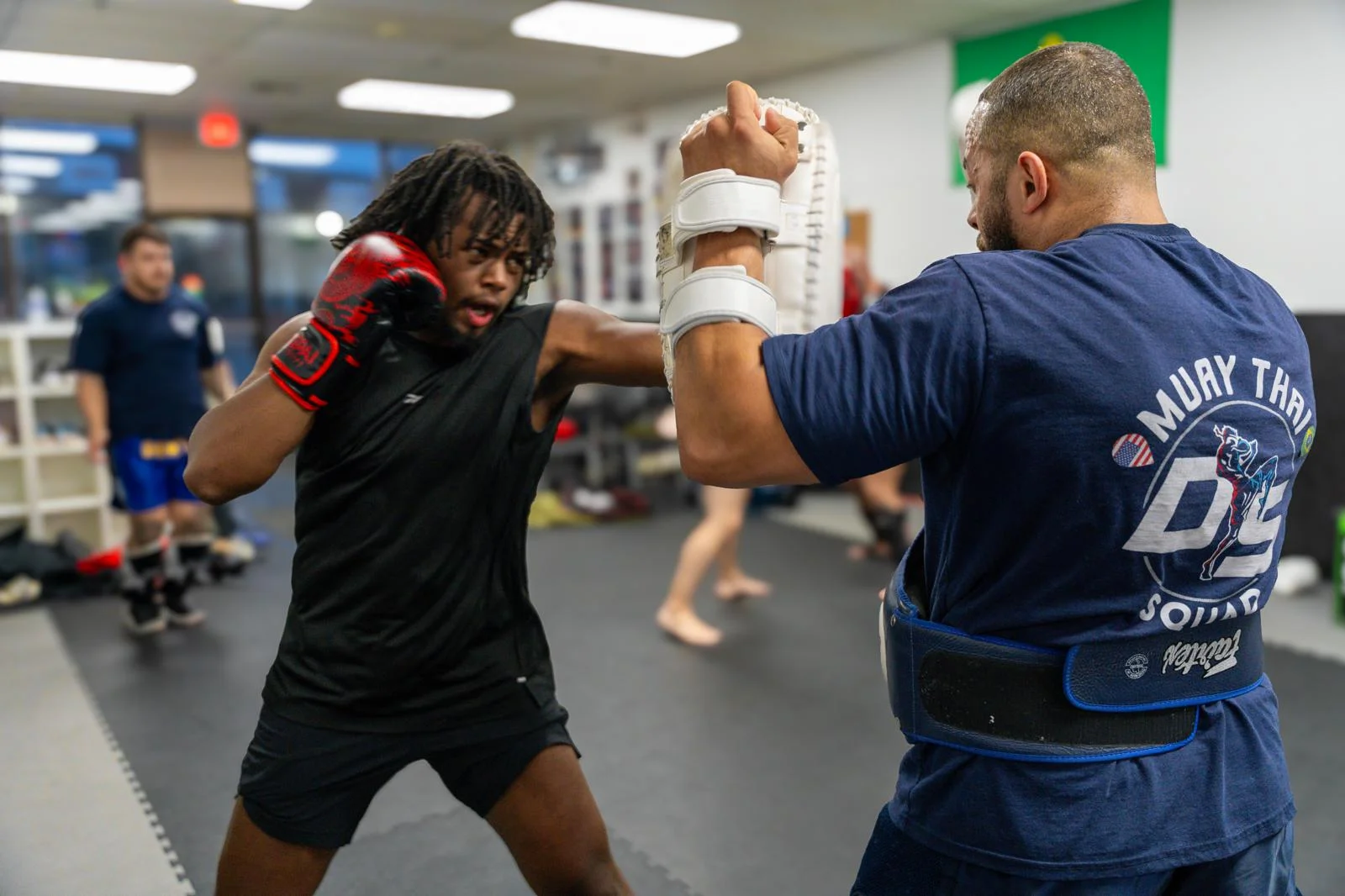 Adult sparring with the coach